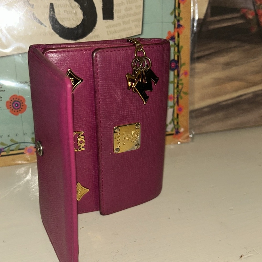 MCM trifold wallet with gold hardware and MCM AUTHENTIC charm - Picture 8 of 8